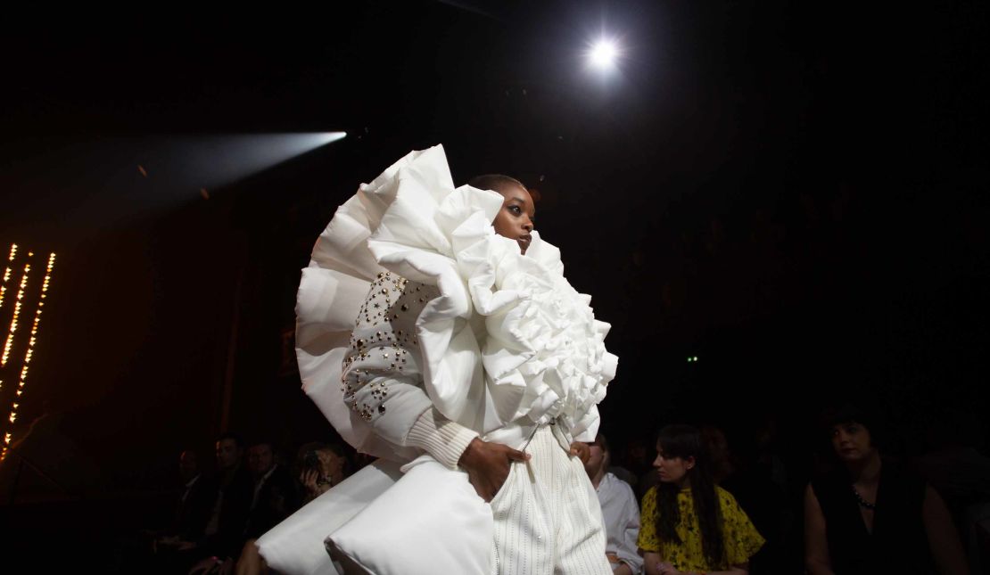 A model presents a creation during the Viktor & Rolf 25th Anniversary catwalk show.