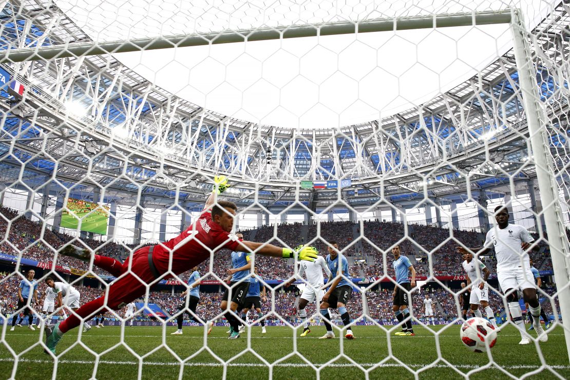 Raphael Varane scores for France against Uruguay.