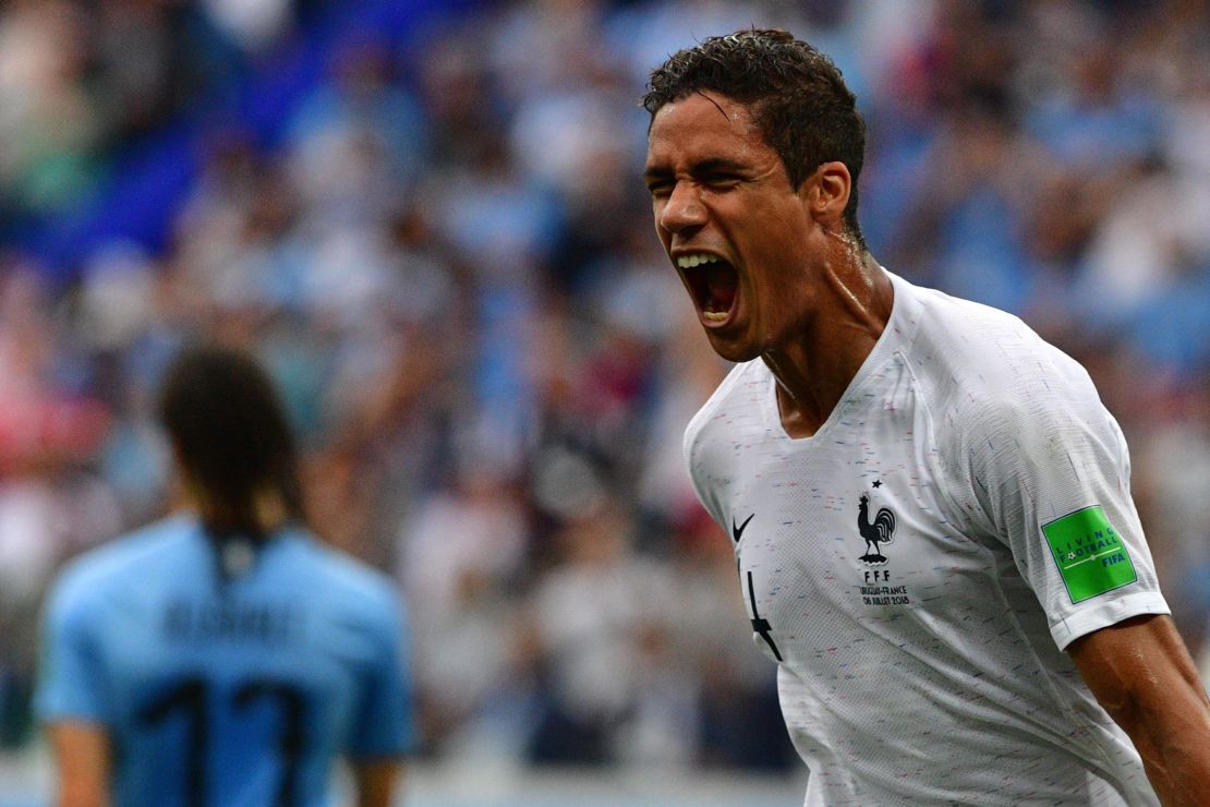 Raphael Varane celebrates after scoring against Uruguay.