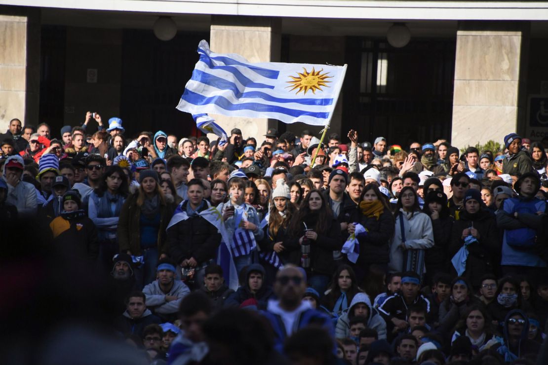 Uruguay fans watch their country's match against France on a big screen at City Hall explanade in Montevideo.