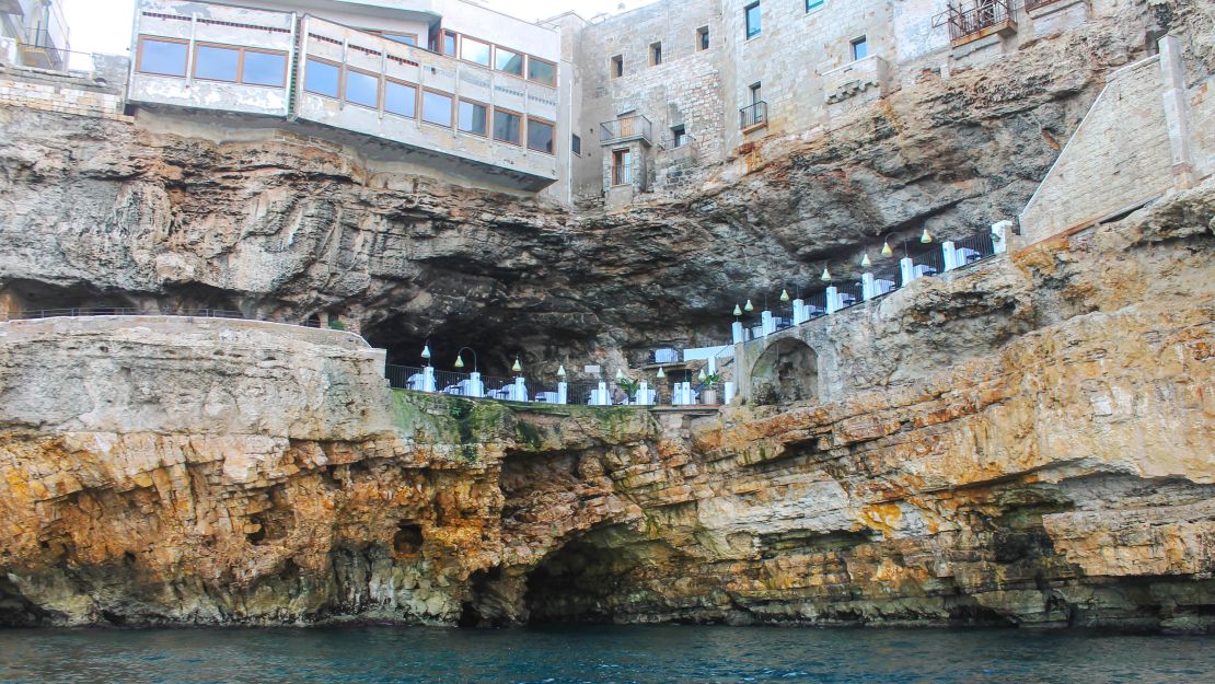 Polignano e Mare has restaurants carved into the cliffs.