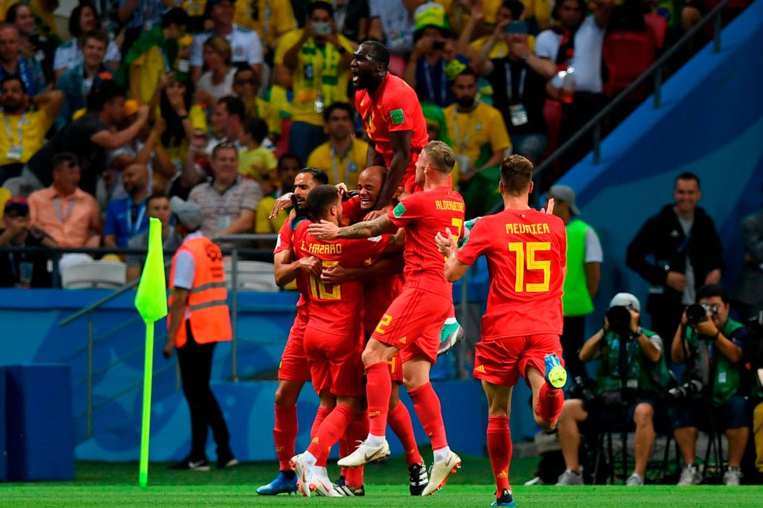 Belgium players celebrates their opening goal against Brazil.