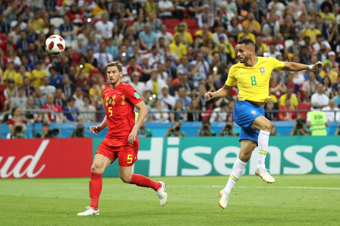 Renato Augusto of Brazil scores for Brazil against Belgium.