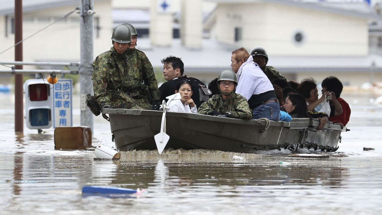 Japanese military personnel evacuate residents in Kurashiki, Okayama prefecture.