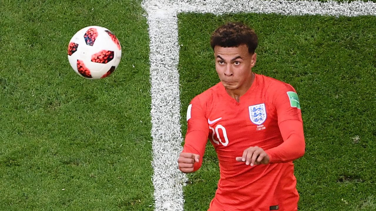 England midfielder Dele Alli heads the ball to score the second goal.