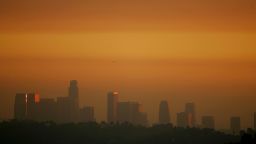LOS ANGELES, CA - NOVEMBER 17:  The downtown skyline is enveloped in smog shortly before sunset on November 17, 2006 in Los Angeles, California. Earlier this month, the South Coast Air Quality Management District, southern California?s anti-smog agency, approved a $36 million program to reduce pollution from trucks operating at the twin ports of Los Angeles and Long Beach. An estimated 12,000 diesel trucks travel to and from the ports each day, carrying freight through southern California metropolitan areas where their emissions are believed to increased risks of asthma and other illnesses among local residents and particularly children.  (Photo by David McNew/Getty Images)