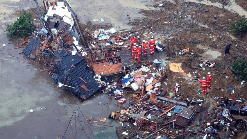 RESTRICTED

UWAJIMA, JAPAN - JULY 07:  (CHINA OUT, SOUTH KOREA OUT) In this aerial image, fire fighters checke a collapsed house which was washed away to a beach on July 7, 2018 in Uwajima, Ehime, Japan. 50 people are dead and at least 67 missing in heavy rains that have lashed western Japan since July 3, triggering landslides and flooding in wide areas.  (Photo by The Asahi Shimbun via Getty Images)