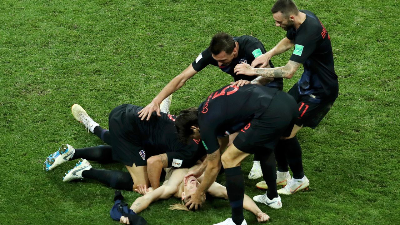 Domagoj Vida is mobbed by his teammates after scoring the winner.