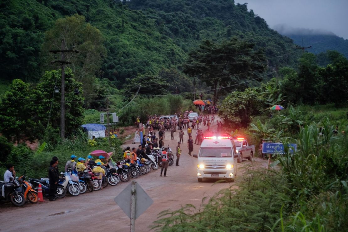 An ambulance leaves the Tham Luang cave area after divers evacuated some of the 12 boys trapped with their coach for 15 days.