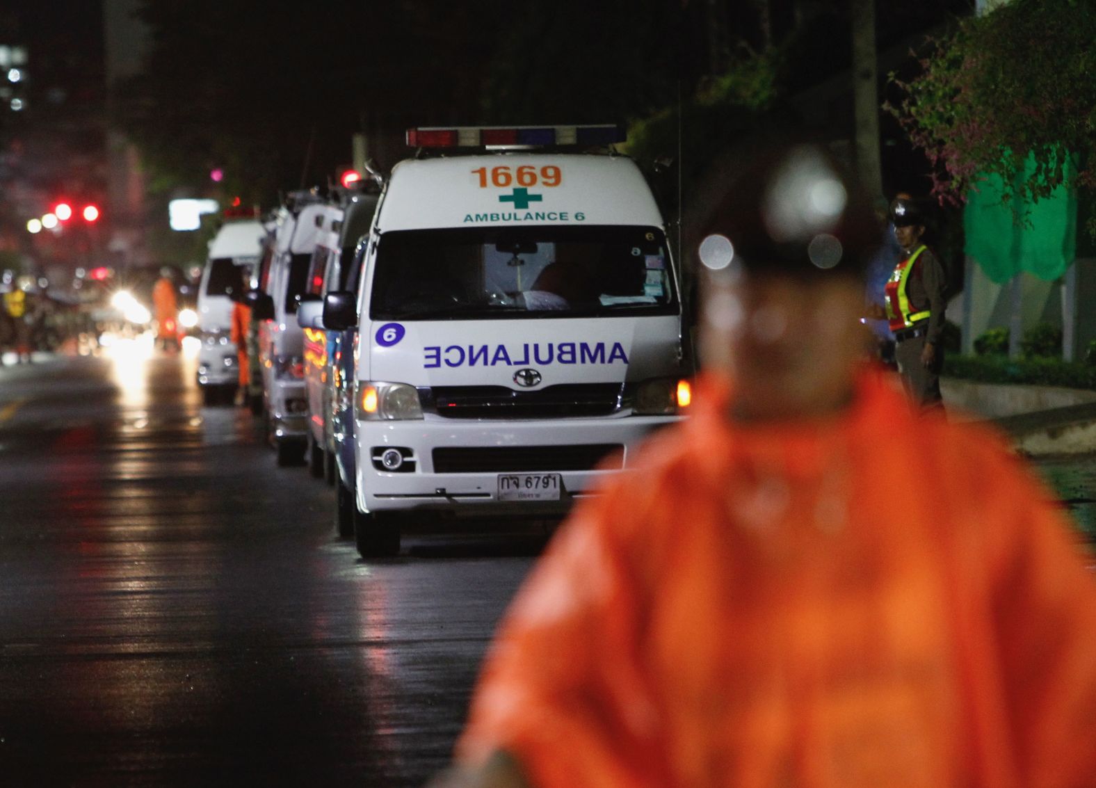 Ambulances wait outside a hospital where the rescued boys were treated.