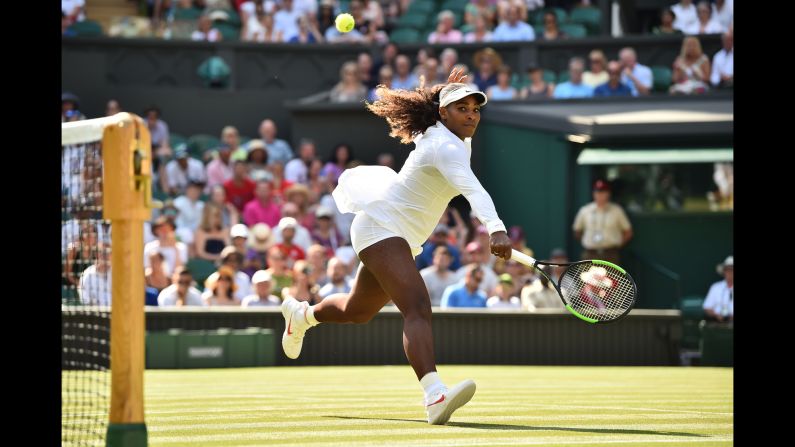 US player Serena Williams returns to France's Kristina Mladenovic in their women's singles match on the fifth day of the 2018 Wimbledon Championships in London on Friday, July 6. 