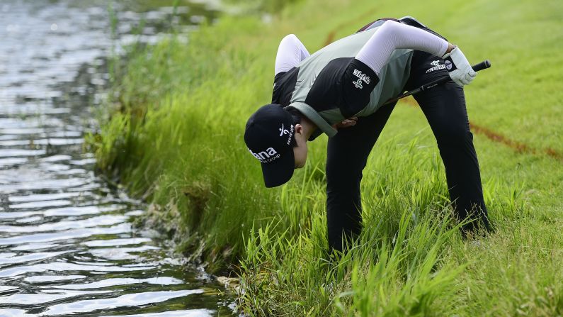 Park Sung-hyun looks for her ball in the rough during the final round of the KPMG Women's PGA Championship golf tournament on Sunday, July 1, in Kildeer, Illinois. 