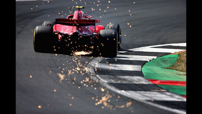 Sparks fly behind Kimi Raikkonen driving the Scuderia Ferrari SF71H on track during final practice for the Formula One Grand Prix of Great Britain on Saturday, July 7, in Northampton, England. 