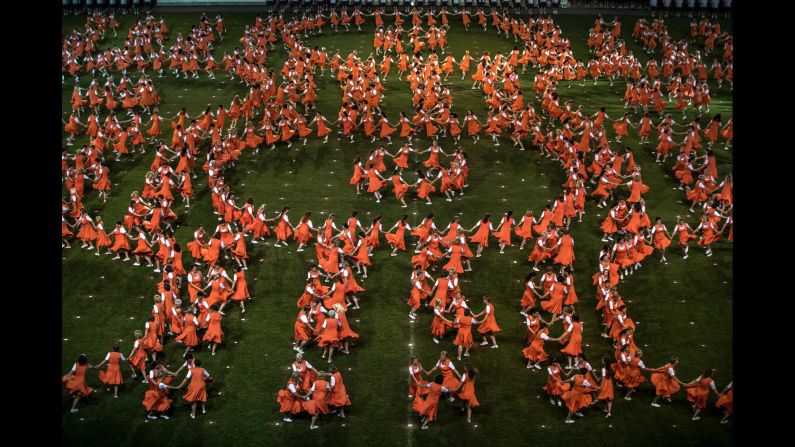 Members of the Czech Sokol sport organization form patterns as they exercise during the All-Sokol Festival in Prague, Czech Republic, on Thursday, July 5. 