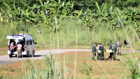 A stretcher carrying what is believed to be the fifth boy rescued from the cave is taken to an ambulance parked near the Tham Luang Nang Non cave.