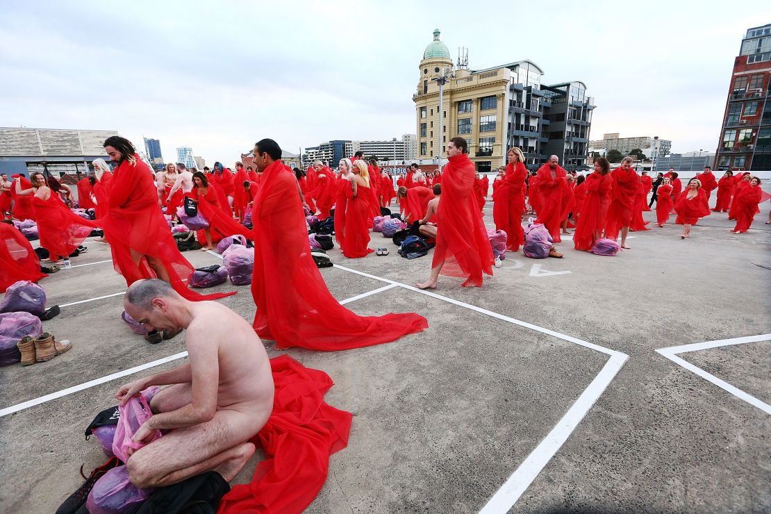 Participants pose as part of Tunick's art installation "Return of the Nude," on July 9, 2018 in Melbourne, Australia.