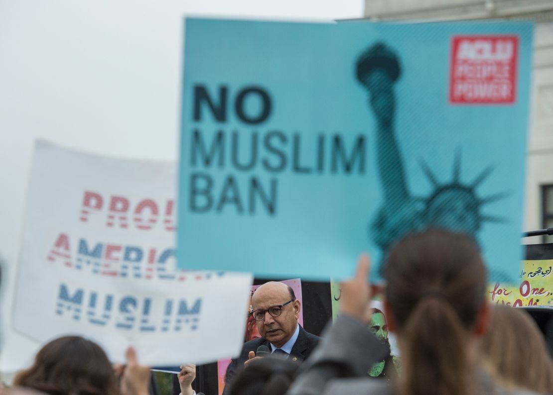 Khan addresses activists and reporters at the Supreme Court in April, when the justices heard arguments on the travel ban.