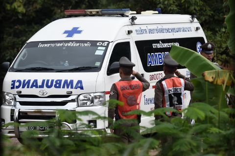 An ambulance exits the cave area on July 9.