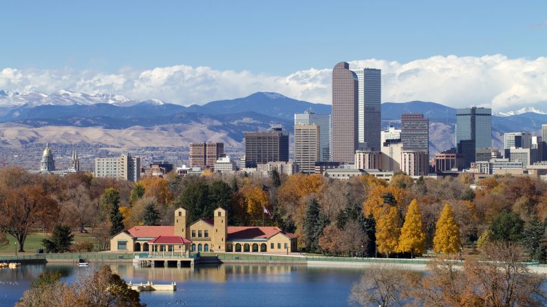 <strong>November in Denver, Colorado:</strong> The Rocky Mountains provide a dramatic backdrop for the modern Denver skyline. You can enjoy a walk in one of Denver's parks during a brisk November day.