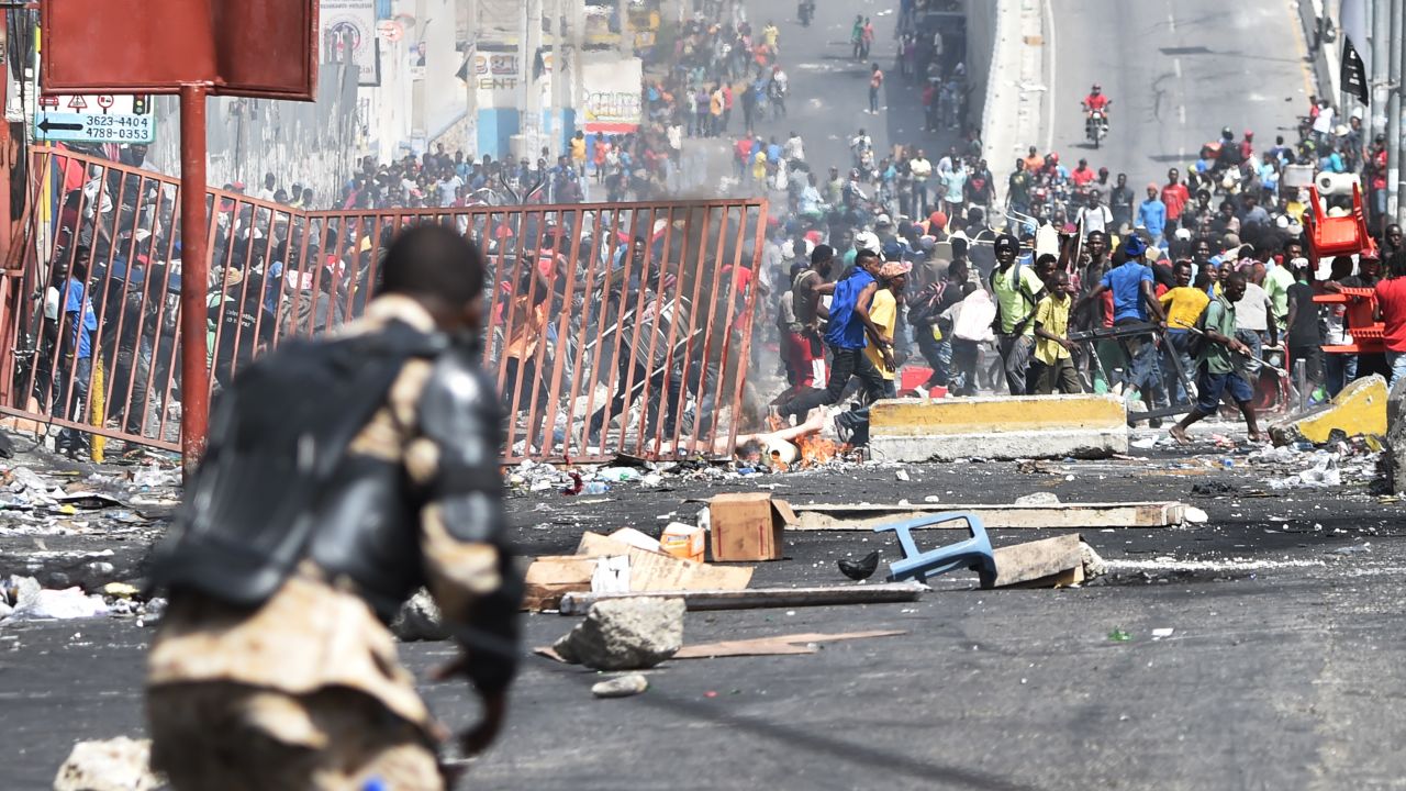 Looting broke out on the streets of Haiti's capital on July 8, after two days of deadly protests over ultimately suspended fuel price hikes.