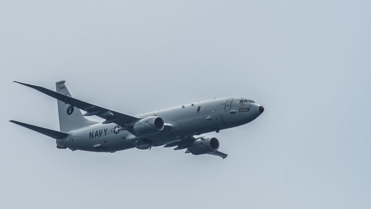 170829-N-GP724-096 
PACIFIC OCEAN (Aug. 29, 2017) A P-8A Poseidon assigned to the "Skinny Dragons" of Patrol Squadron (VP) 4 flies over the aircraft carrier USS Theodore Roosevelt (CVN 71). Theodore Roosevelt is underway conducting a composite training unit exercise (COMPTUEX) with its carrier strike group in preparation for an upcoming deployment. COMPTUEX tests a carrier strike group's mission readiness and ability to perform as an integrated unit through simulated real-world scenarios. (U.S. Navy photo by Mass Communication Specialist 3rd Class Alex Perlman/Released)