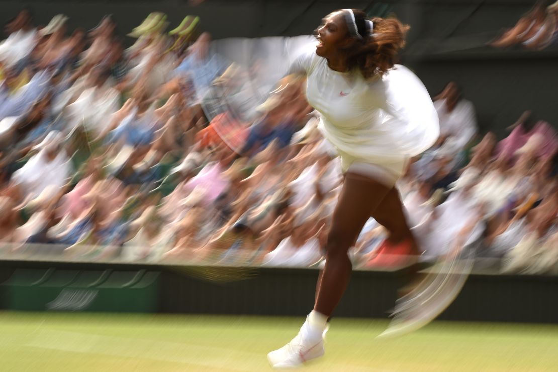 Serena Williams hits a serve Monday at Wimbledon. 