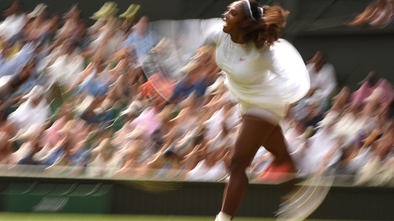 Serena Williams hits a serve Monday at Wimbledon. 