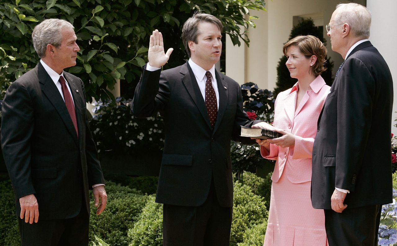 Kavanaugh is joined by his wife and US President George W. Bush as Justice Anthony Kennedy swears him in to be a federal judge in June 2006. Kavanaugh once clerked for Kennedy and now could be the judge to replace him on the Supreme Court.