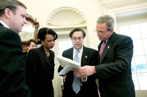 Kavanaugh stands behind National Security Adviser Condoleezza Rice as President George W. Bush, right, reviews his State of the Union speech in January 2004.
