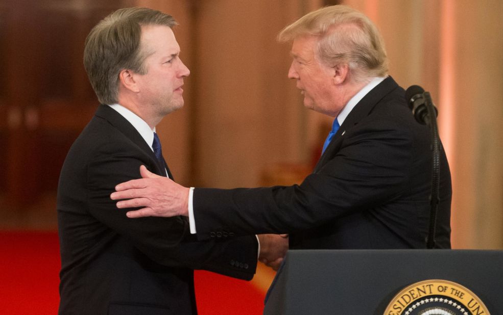 Supreme Court nominee Brett Kavanaugh, left, shakes hands with President Donald Trump on Monday, July 9.