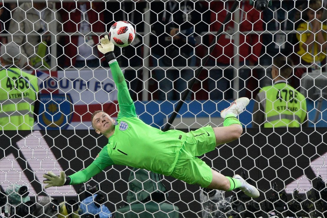 Pickford stops Colombia's forward Carlos Bacca's shot during the penalty shootout.