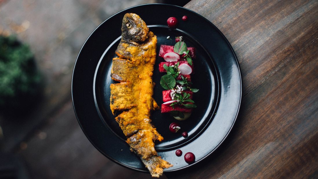 <strong>Popular Cocina Boliviana. </strong>Trout from the high-altitude Lake Titicaca, on the border between Bolivia and Peru, is served with yuca and potato purée in a beet emulsion.