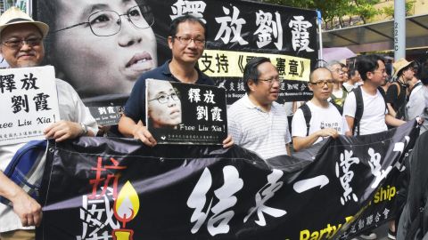 People march in Hong Kong in democracy protest on July 1, calling on China to release Liu Xia, the widow of China's late Nobel Peace Prize laureate Liu Xiaobo, who has been under house arrest for years.