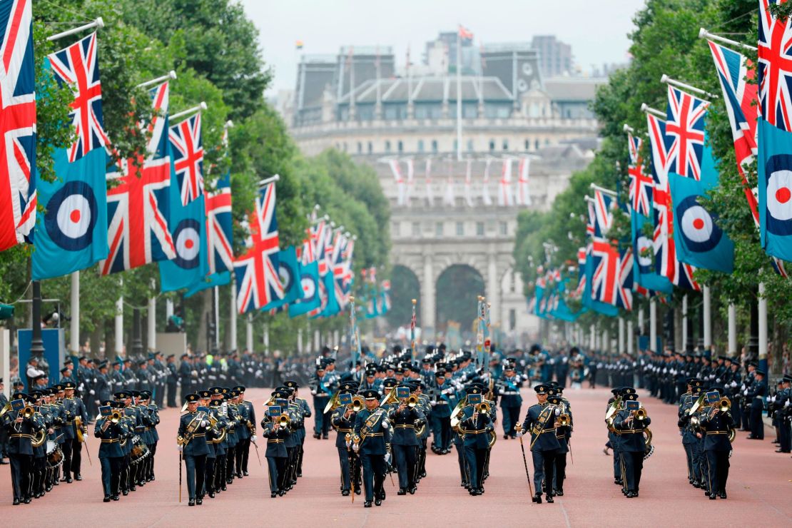 The band of the Royal Air Force parades on the Mall, which is bedecked with RAF ensigns, toward Buckingham Palace on Tuesday.