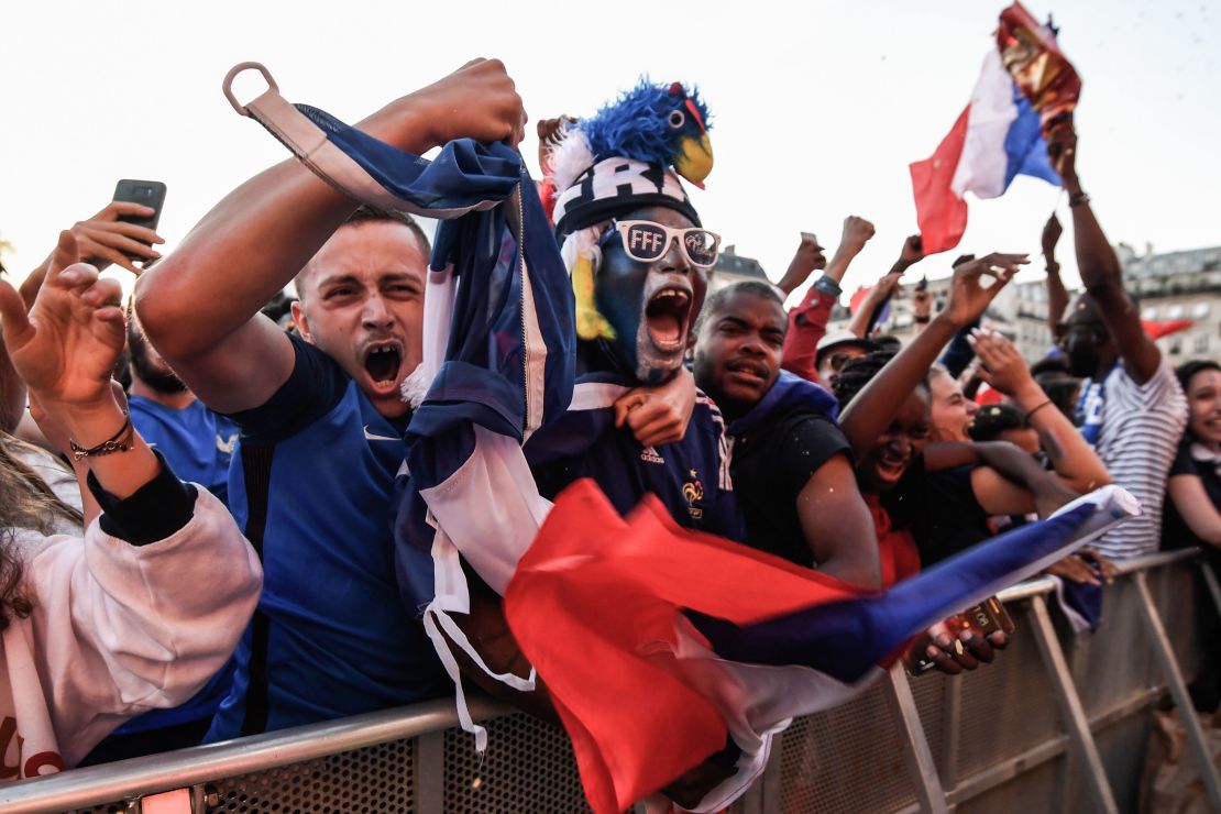 French football fans celebrate in Paris.