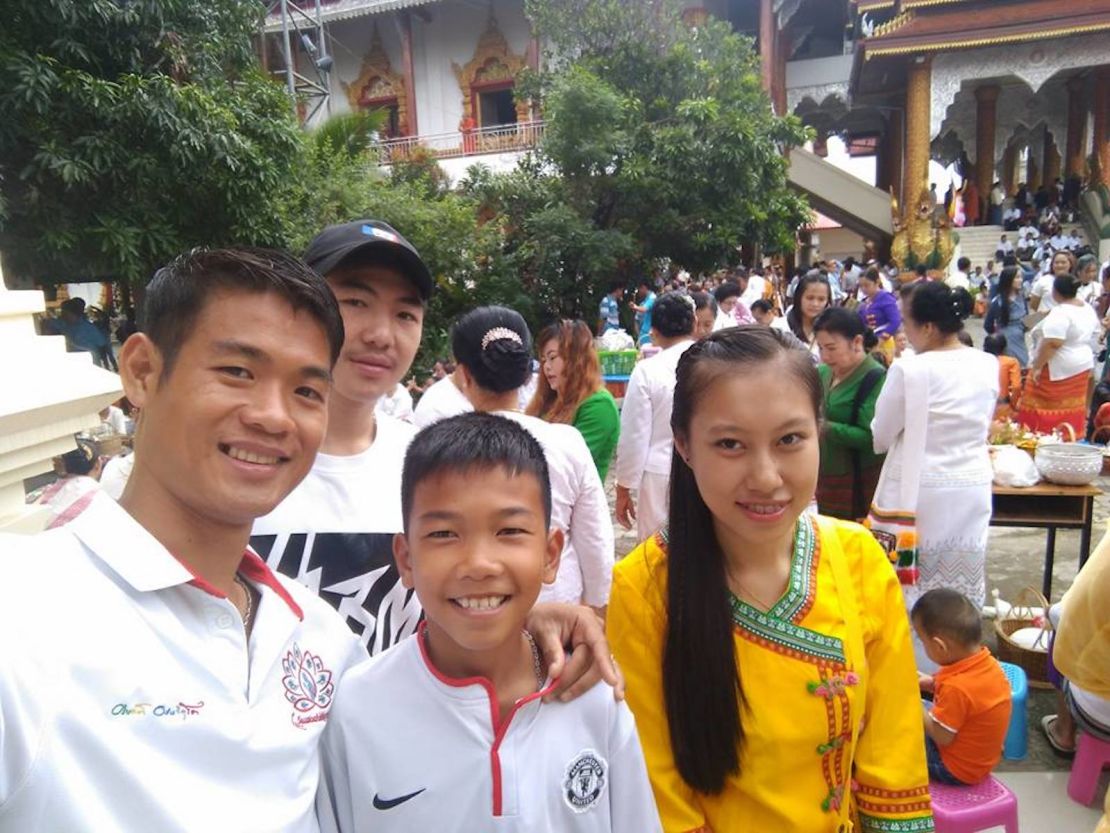 Ekkapol Ake Chantawong, the 25-year-old coach of the Wild Boars soccer team, seen with 11-year-old Chanin Viboonrungruang, who was also trapped in the cave. 