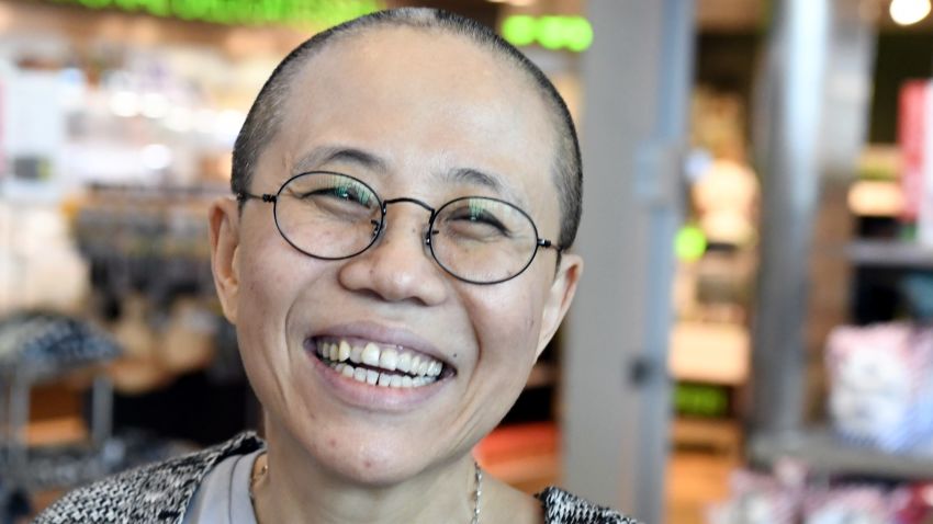 Liu Xia, the widow of Chinese Nobel dissident Liu Xiaobo, smiles as she arrives at the Helsinki International Airport in Vantaa, Finland, on July 10, 2018. - Despite facing no charges, the 57-year-old poet had endured heavy restrictions on her movements since 2010 when her husband won the Nobel Peace Prize -- an award that infuriated Beijing. (Photo by Jussi Nukari / Lehtikuva / AFP) / Finland OUT        (Photo credit should read JUSSI NUKARI/AFP/Getty Images)