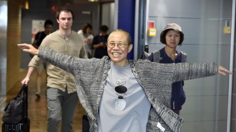 Liu Xia, the widow of Chinese Nobel dissident Liu Xiaobo, smiles as she arrives at the Helsinki International Airport in Vantaa, Finland, on Tuesday.