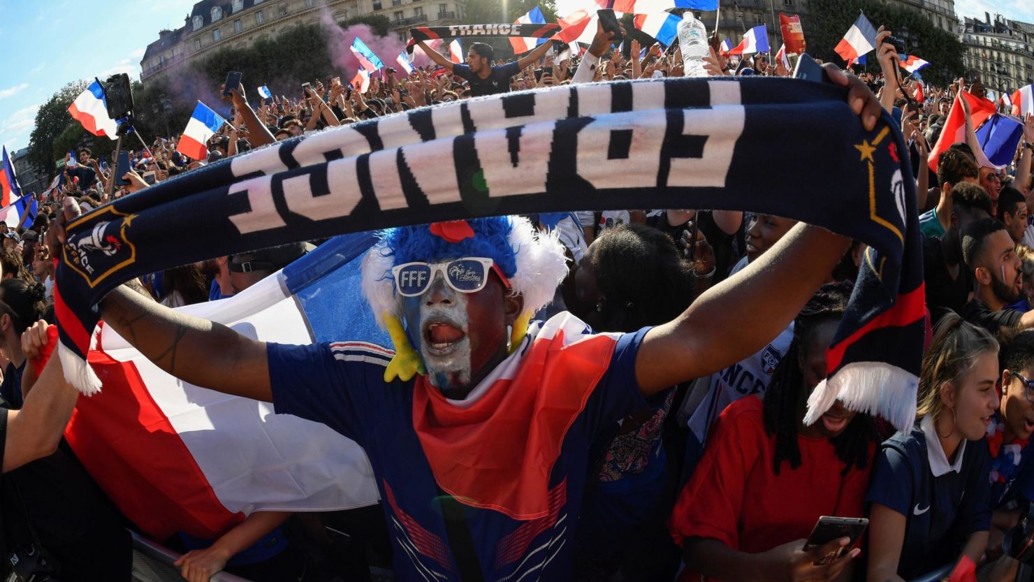 French football supporters watch the semifinal match against Belgium in a fan zone in Paris.