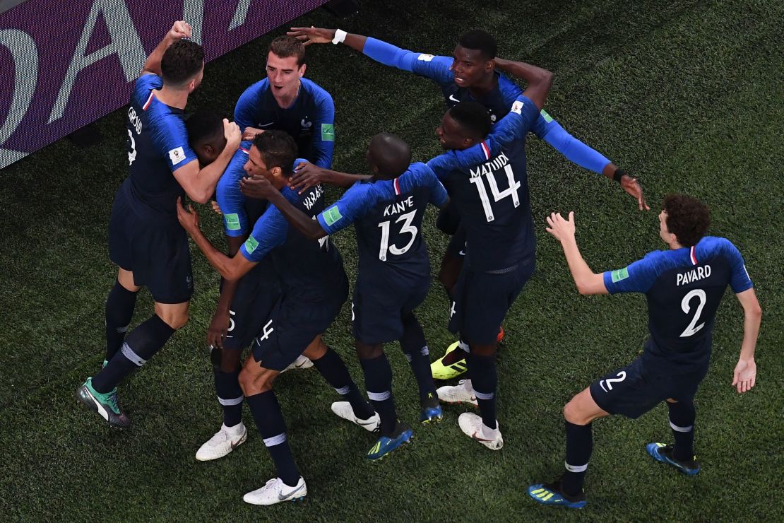 Samuel Umtiti celebrates with teammates after scoring the game's only goal.