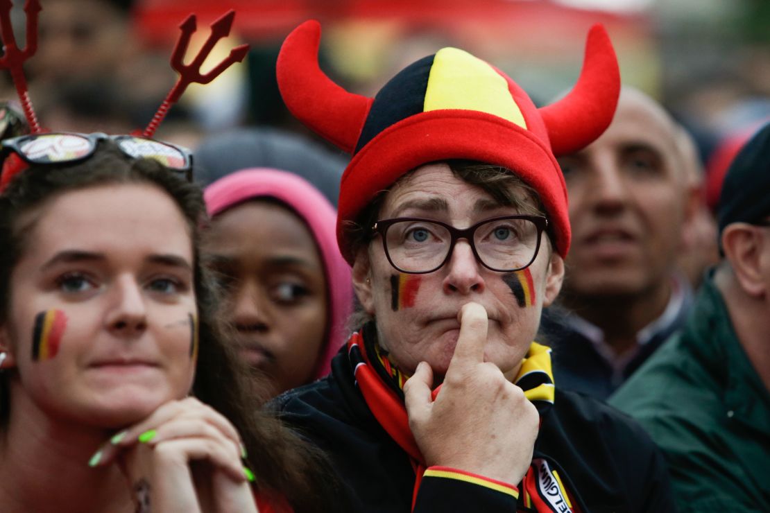 Belgium supporters at a fan zone in Brussels react after France's scores its first goal.