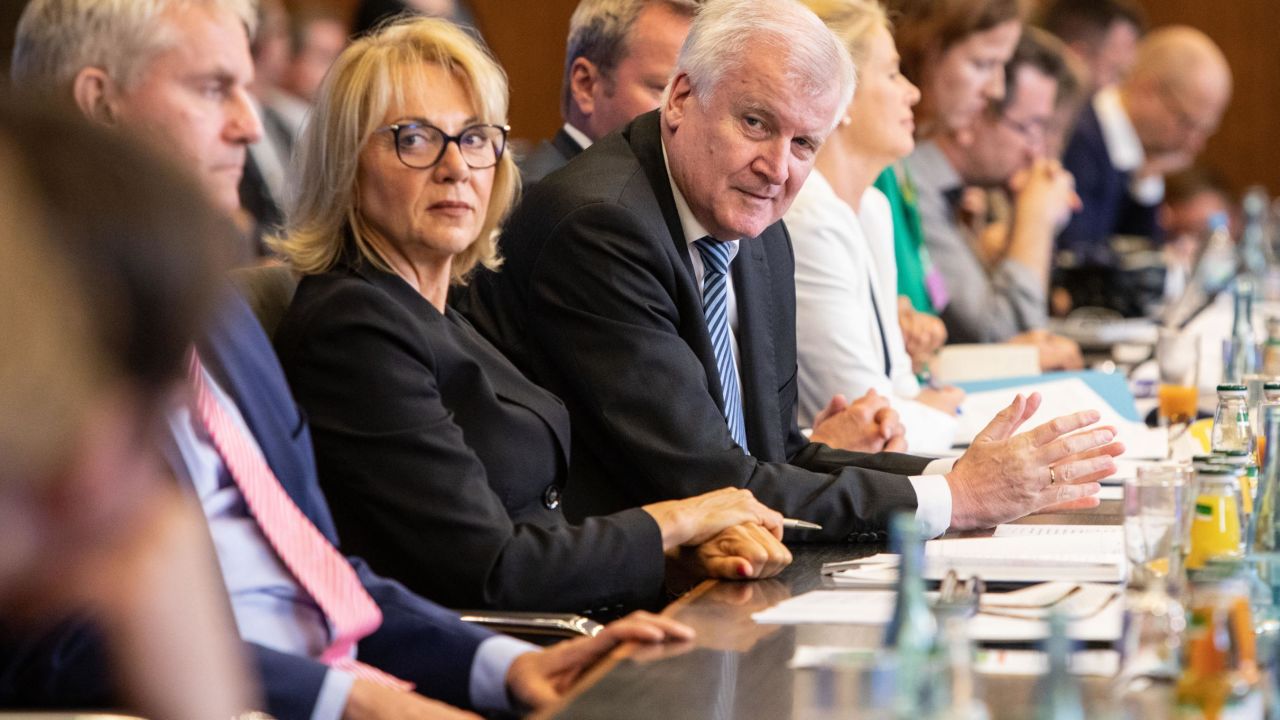 German Interior Minister Horst Seehofer (C) presents his controversial "migration master plan" on July 10.