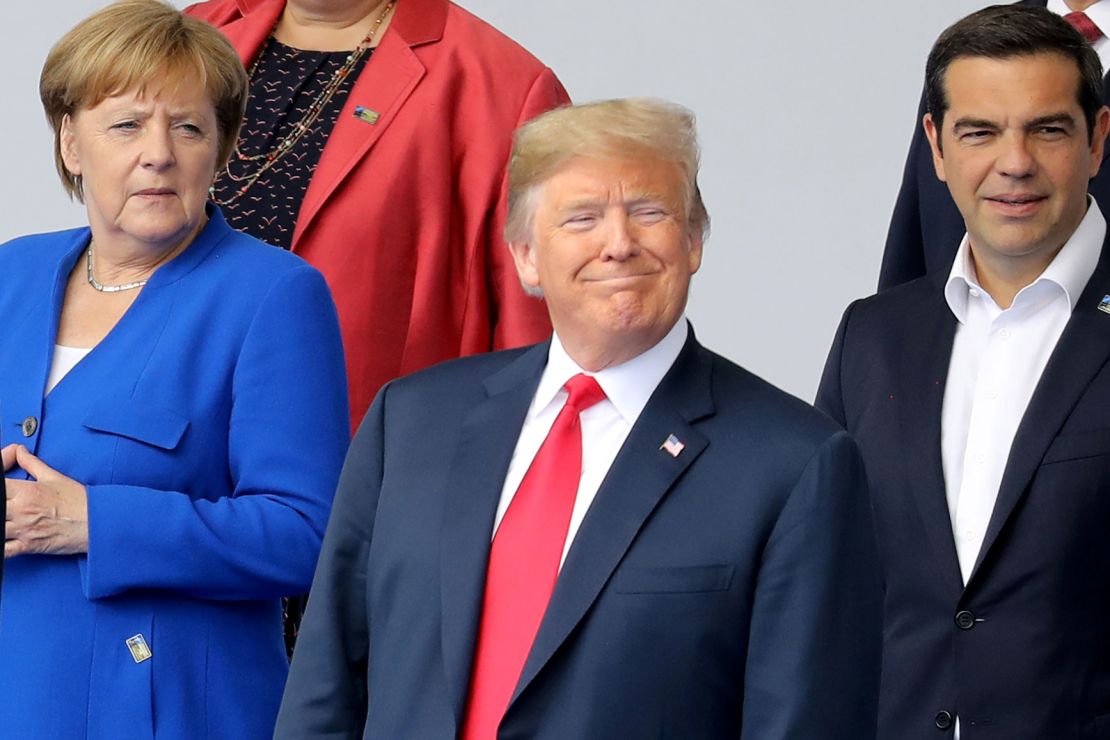 (LtoR) German Chancellor Angela Merkel, US President Donald Trump and Greek Prime Minister Alexis Tsipras pose for a family picture ahead of the opening ceremony of the NATO (North Atlantic Treaty Organization) summit, at the NATO headquarters in Brussels, on July 11, 2018. (Photo by LUDOVIC MARIN / POOL / AFP)        (Photo credit should read LUDOVIC MARIN/AFP/Getty Images)