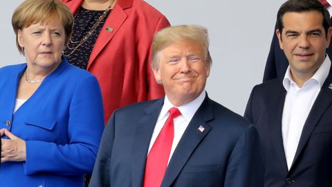 (LtoR) German Chancellor Angela Merkel, US President Donald Trump and Greek Prime Minister Alexis Tsipras pose for a family picture ahead of the opening ceremony of the NATO (North Atlantic Treaty Organization) summit, at the NATO headquarters in Brussels, on July 11, 2018. (Photo by LUDOVIC MARIN / POOL / AFP)        (Photo credit should read LUDOVIC MARIN/AFP/Getty Images)