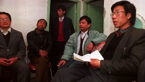 Qin Yongmin (R) meets with fellow pro-democracy activists in a Beijing apartment to announce the formation 14 Novembeer 1993 of a "Peace Charter" group, calling on the Communist Party to accept a multi-party system.