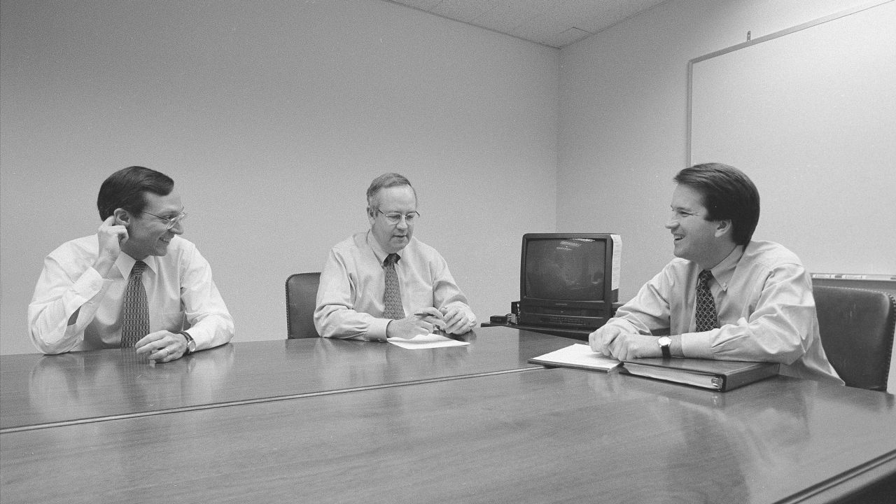 WASHINGTON DC -- NOVEMBER 13: Independent Counsel Kenneth Starr, center, talks with Deputy Independent Counsel John Bates, left, and aide Brett Kavanaugh, right, and another colleague in the Office of the Solicitor General during the Whitewater Investigation on November 13, 1996 in Washington DC. (Photo by David Hume Kennerly/Getty Images)