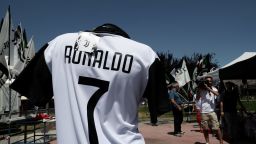 A picture taken on July 7, 2018 in Turin shows a Cristiano Ronaldo's Juventus T-shirt in a stand near the Allianz Stadium in Turin. - Spain's media said goodbye to superstar Cristiano Ronaldo while Italy's welcomed him on Friday after persistent reports that the five-time Ballon d'Or winner will leave Real Madrid for Italian champions Juventus. (Photo by Isabella Bonotto / AFP)        (Photo credit should read ISABELLA BONOTTO/AFP/Getty Images)