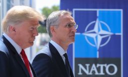 US President Donald Trump (L) walks with NATO Secretary General Jens Stoltenberg as he arrives to attend the NATO (North Atlantic Treaty Organization) summit, in Brussels, on July 11, 2018. (TATYANA ZENKOVICH/AFP/Getty Images)