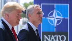 US President Donald Trump (L) walks with NATO Secretary General Jens Stoltenberg as he arrives to attend the NATO (North Atlantic Treaty Organization) summit, in Brussels, on July 11, 2018. (TATYANA ZENKOVICH/AFP/Getty Images)