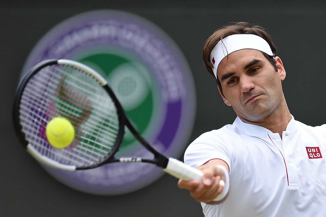 Roger Federer leans into a forehand in his match with Kevin Anderson.